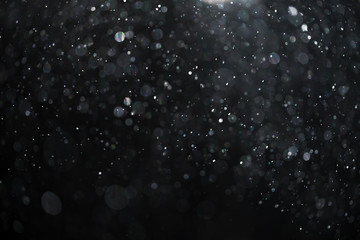 abstract real dust floating over black background for overlay