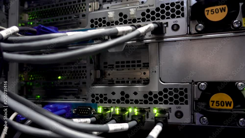 Data center flashing lights. back side of working data servers. router working. Big data center lights. has a small noise Data center flashing lights. back side of working data servers. router working. Big data center lights. has a small noise