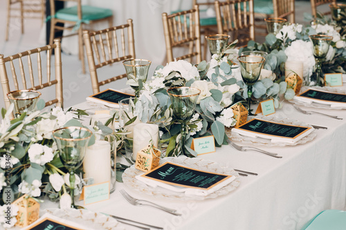 Wedding table decor in white green tones photo