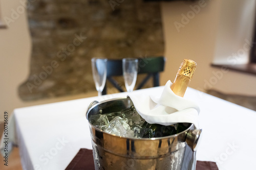 Champagne bottle in a bucket with ice © bonilla1879