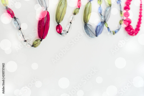 Banner Fashion Accessories Beads costume Jewelry on a light Colored background is Red.