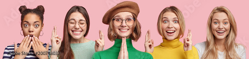 Young attractive women express different emotions, pose together against pink studio background. Shocked dark skinned female, Asian woman with desired look, lovely girl in beret pleads for something
