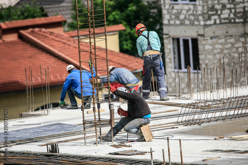The welder welds a metal structure
