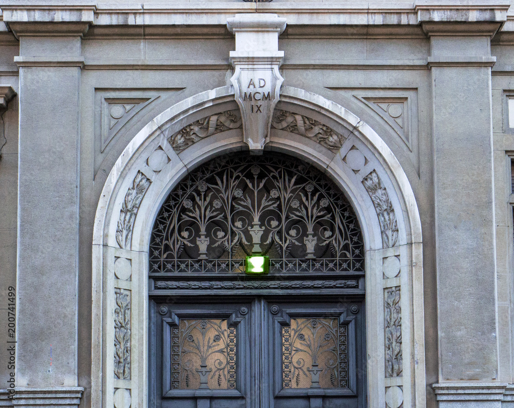 gorgeus door with floral decorations in Milan, the Italian capital of Art Nouveau