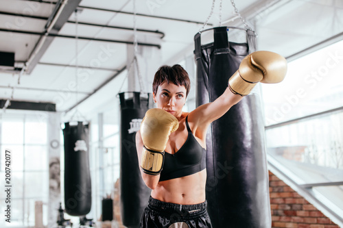 athlete stucking at opponent at sport centure. enjoy boxing.heavy blow. photo