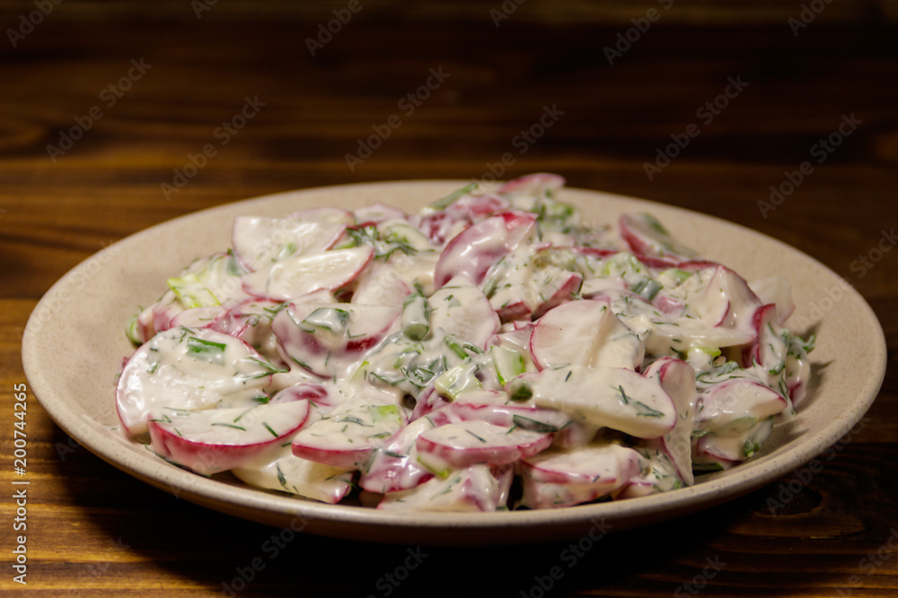 Spring salad with radish, dill and green onions and sour cream Spring salad with radish, dill and green onions and sour cream