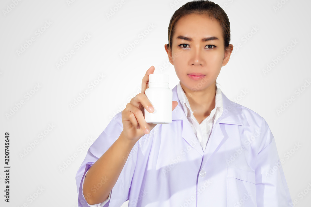 hand of doctor holding medicine bottle on white background hand of doctor holding medicine bottle on white background