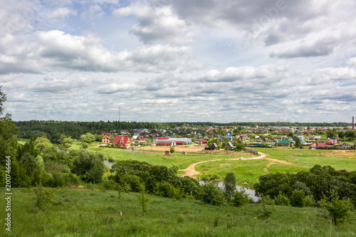 View of the village of Krivskoye, Borovskoy district, Russia. View from the high bank of the Protva River 