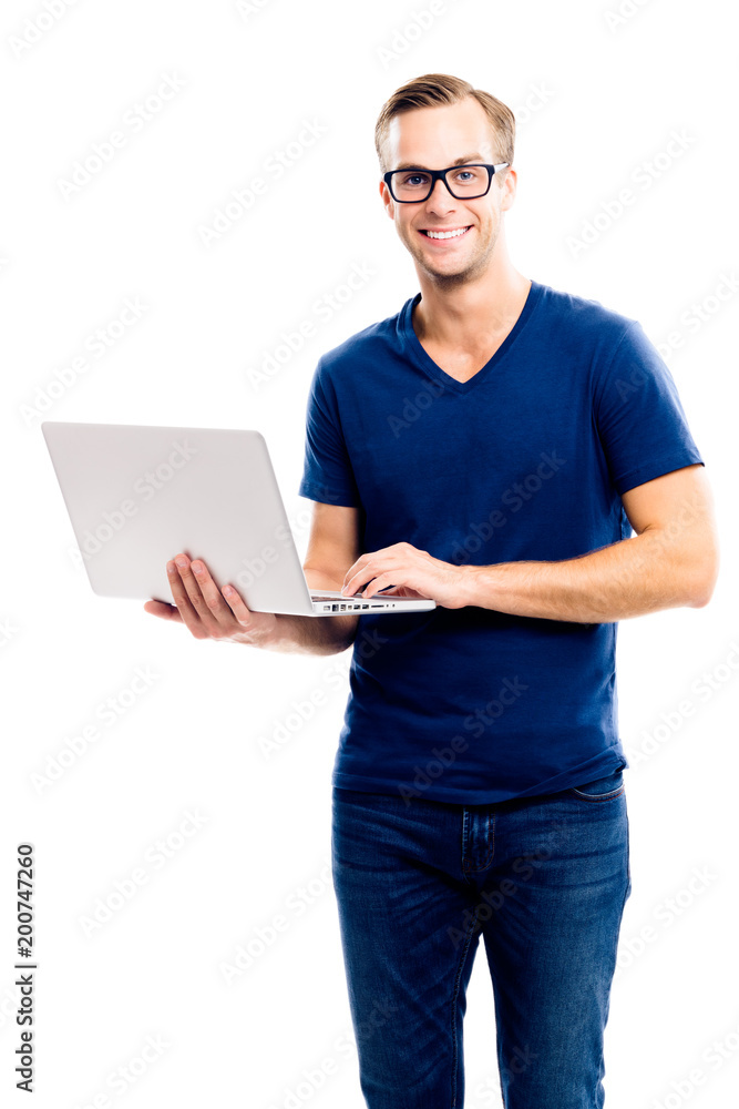 Happy smiling young man working with laptop Happy smiling young man working with laptop