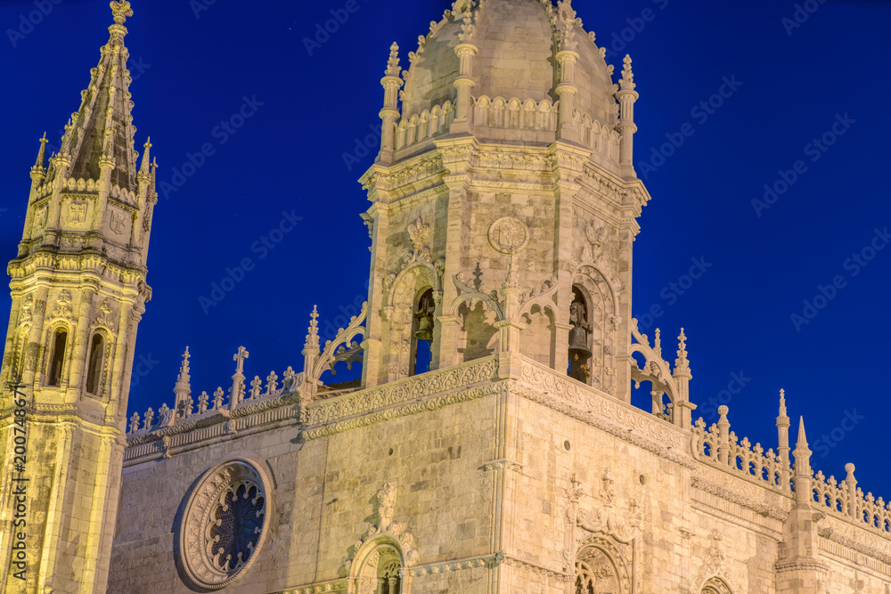 Facade of the Jeronimos (Hieronymites) Monastery in the Belem district of Lisbon illuminated at night