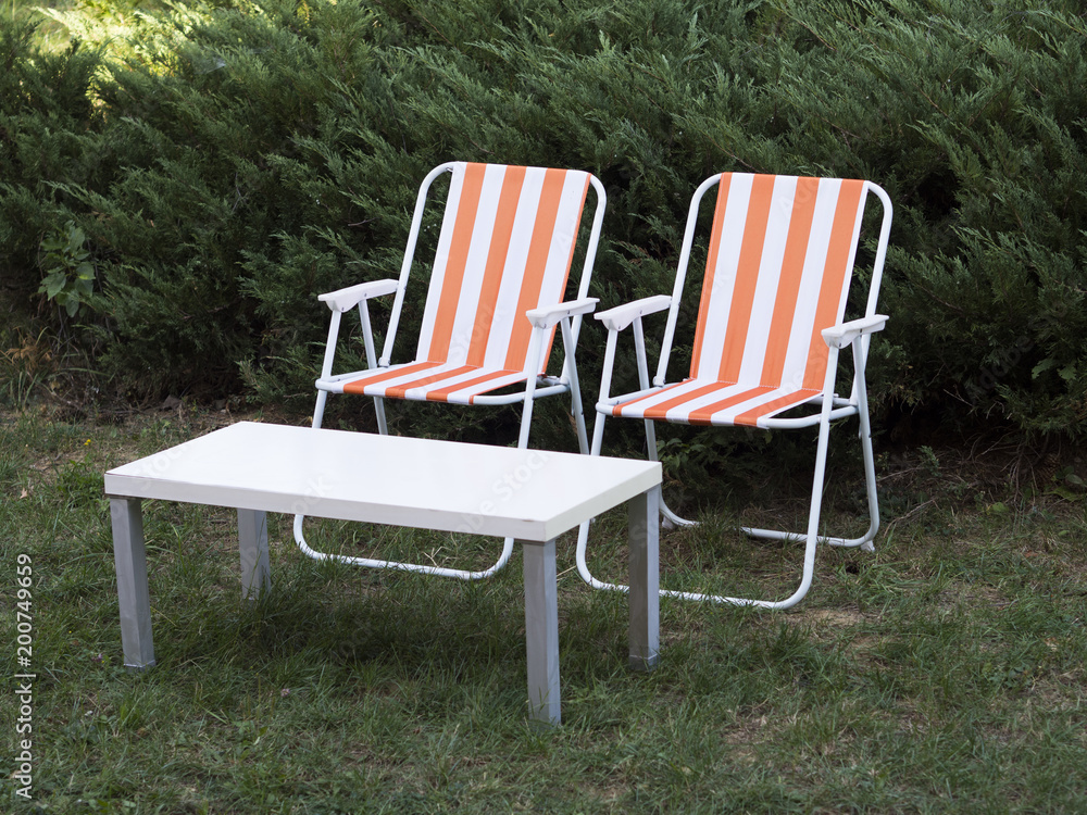Fototapeta premium Two garden chairs and a table