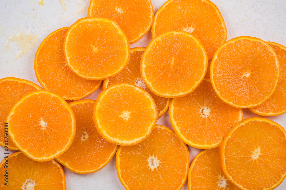Orange slices on marble board, close up Orange slices on marble board, close up