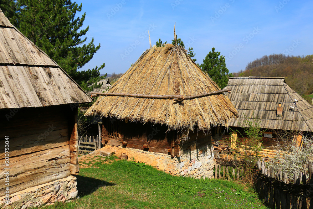 Traditional old wooden house with straw roof