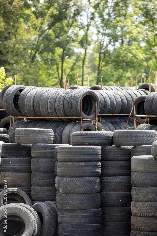A large stack of used automotive car tires A large stack of used automotive car tires