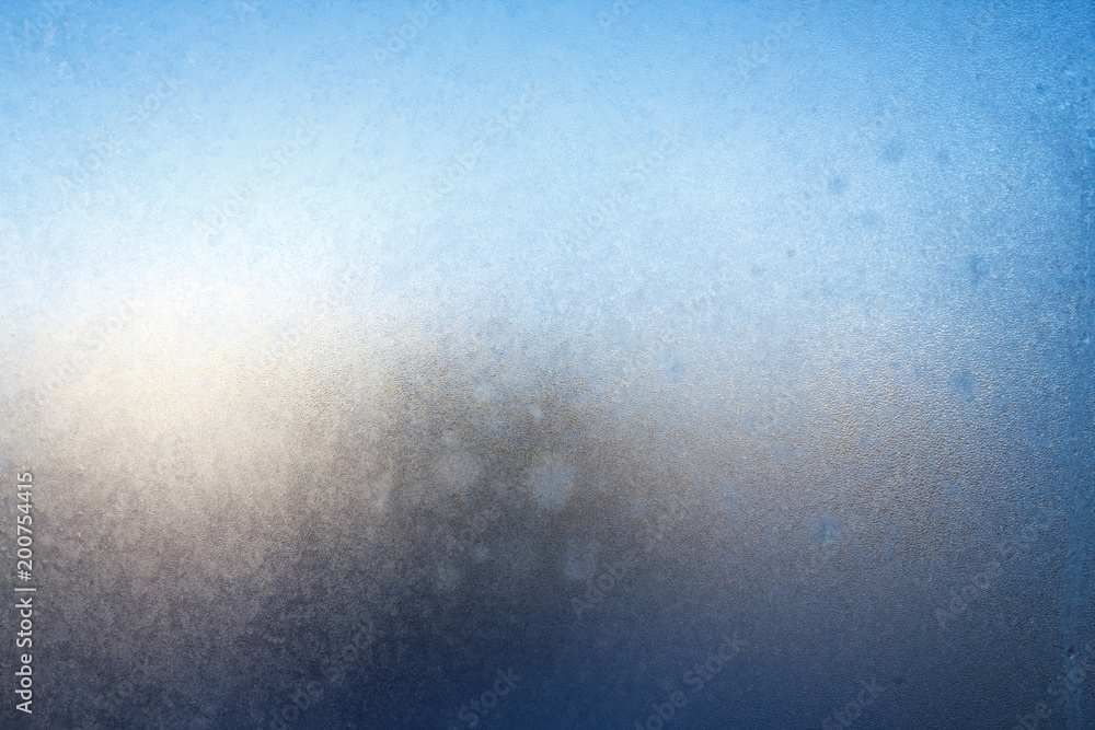 Obraz premium Frost on window glass close up abstract background photo texture