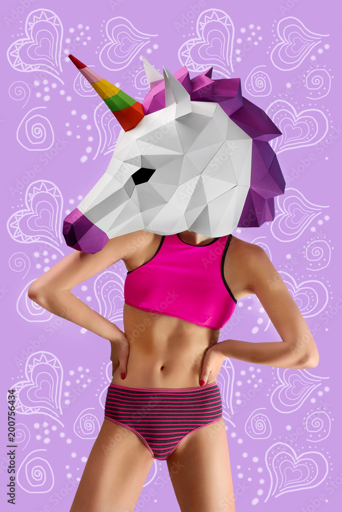 Frontview of slim sporty model wearing paper colorful unicorn's head and  fancy underwear. Standing on intresting saturated violet background with  lines and figures. Nice, stunning body. Photos