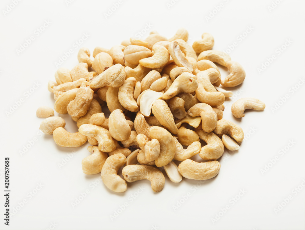 Heap of cashew nuts isolated on white
