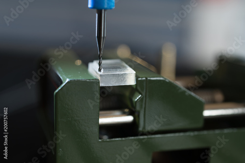 Foto Processing of the plastic workpiece on CNC milling machine