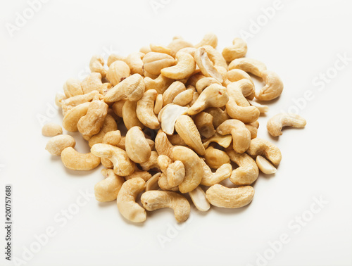 Heap of cashew nuts isolated on white