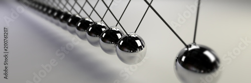 Newton cradle, cause and effect concept, steel infinity Newton's cradle