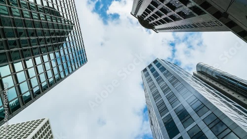 Hong Kong, 4K time-lapse of skyscrapers and clouds, bottom view.