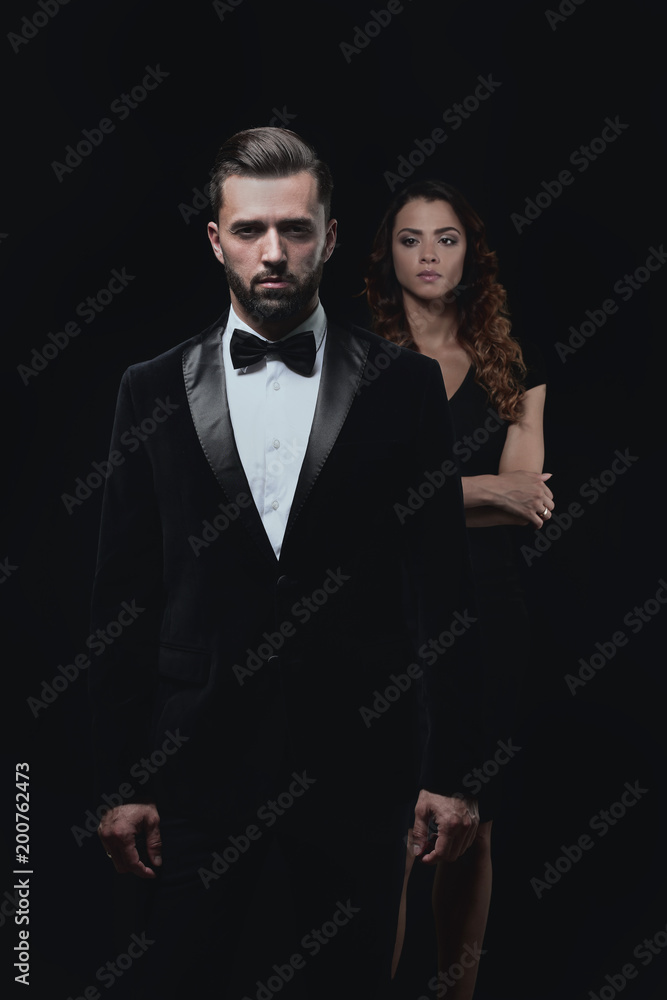 gentleman with his girl posing in the studio gentleman with his girl posing in the studio