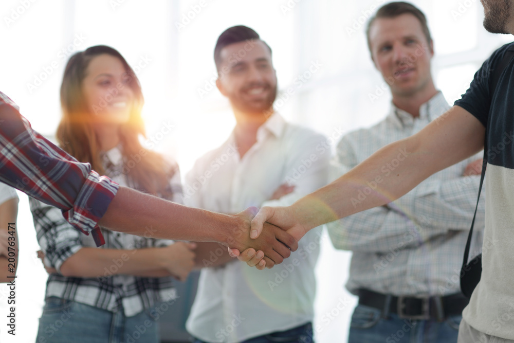 closeup of handshake of business partners closeup of handshake of business partners