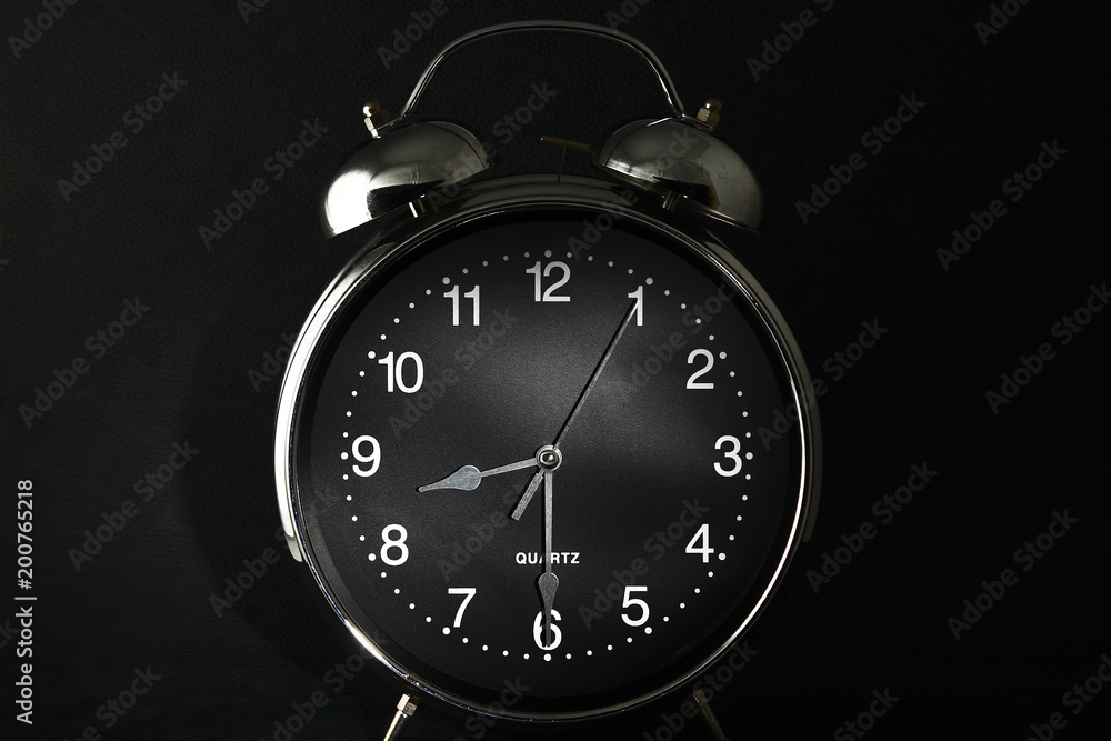 Old retro alarm clock with the hands set to 8:30 am or pm Photos | Adobe  Stock