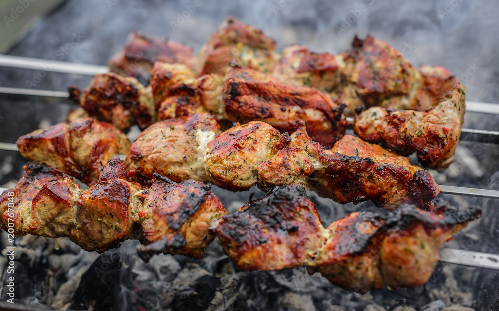 Barbecue or shish kebab is fried on the grill.