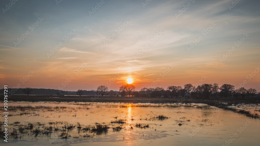 River landscape at sunset in winter
