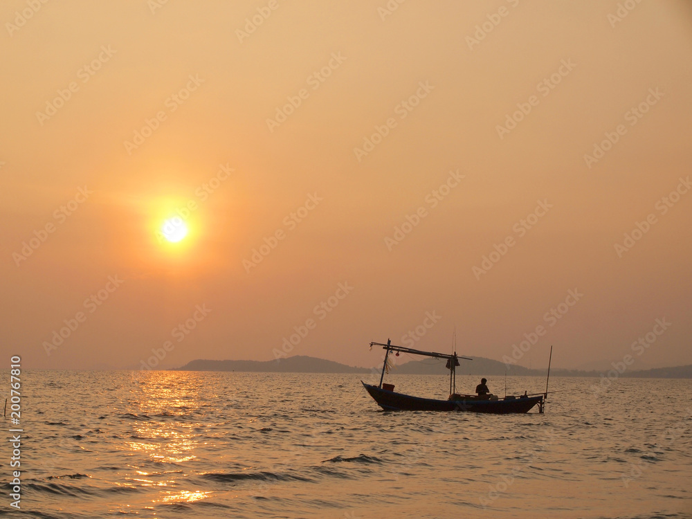 Beautiful sunset over the sea and Fishing boat