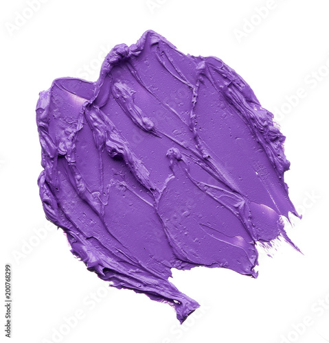 Texture of broken purple lipstick on white