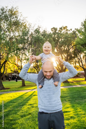 A father with baby son in park