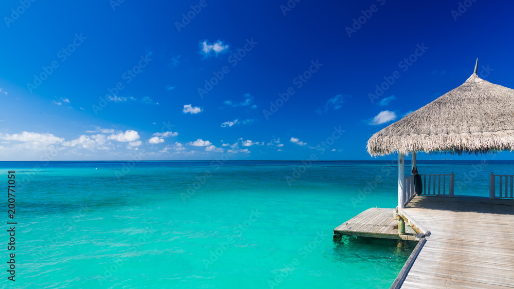 Maldives paradise beach scene. Blue sea and relaxing water villa. Luxury summer vacation background