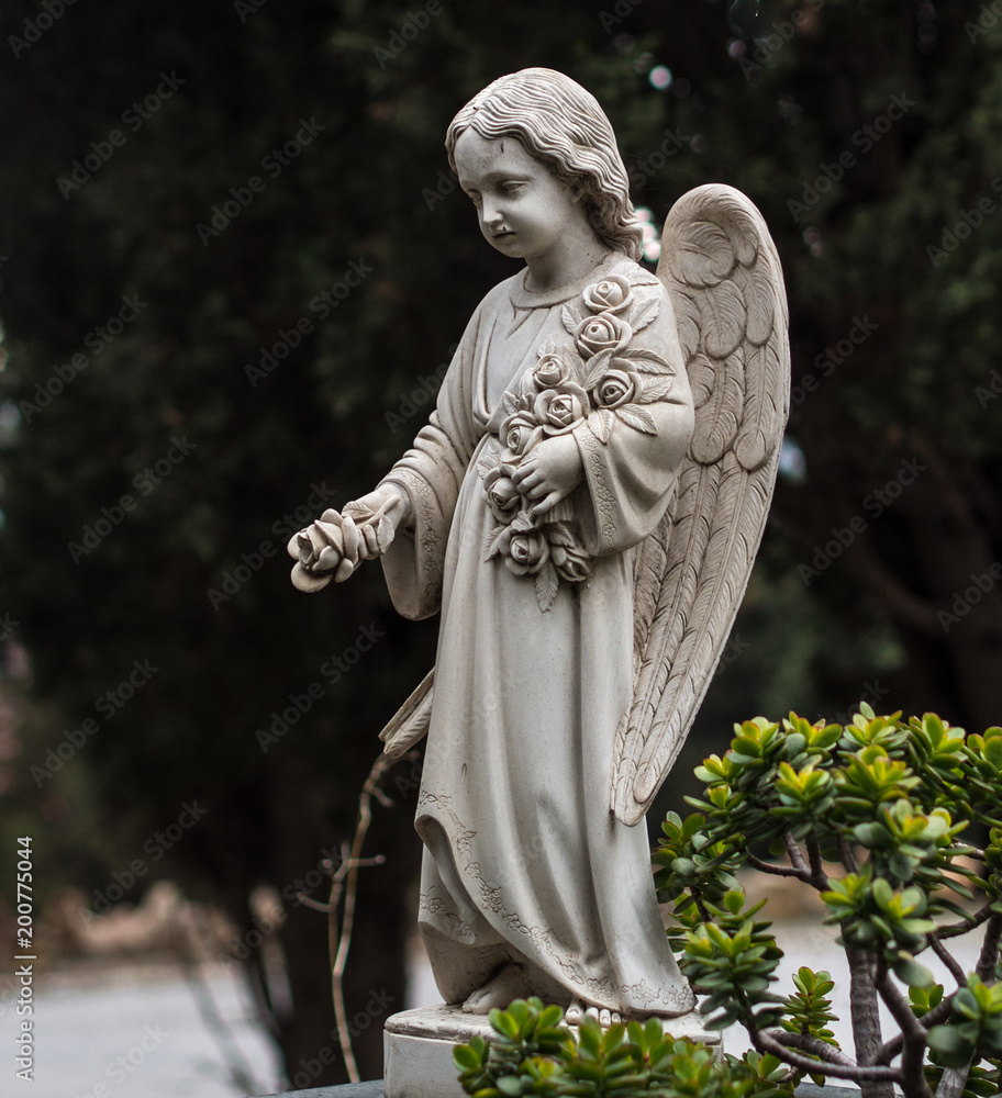 Statue in the cemetery of Montjuic in Barcelona Statue in the cemetery of Montjuic in Barcelona