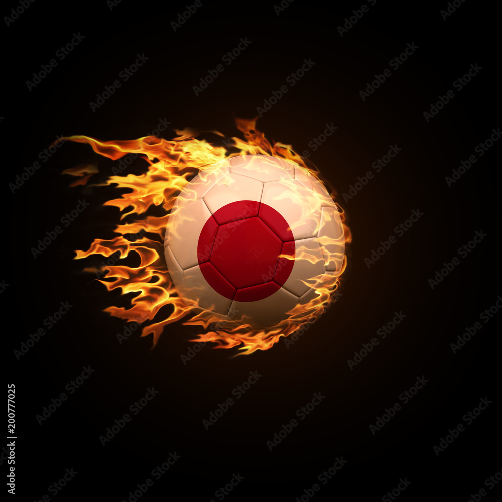 Fototapeta premium A soccer ball with the flag of Japan burning with fire flies on a black background