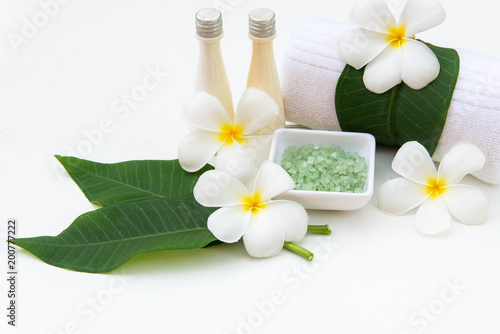 Thai spa composition treatments aroma therapy with Plumeria flowers on white wooden.  Healthy Concept.