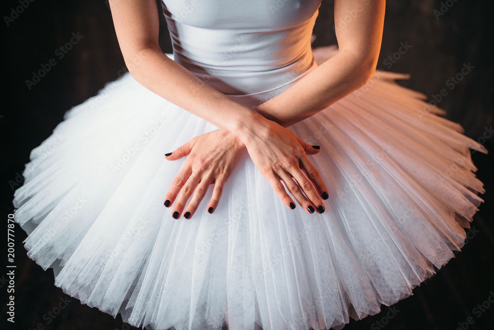 Fototapeta premium Classical ballet dancer in dress and cross hands