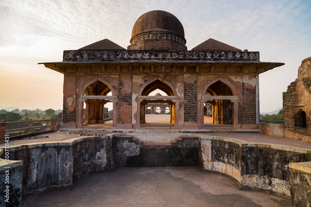 Mandu India, afghan ruins of islam kingdom, mosque monument and muslim tomb. View through door, Hindola Mahal.