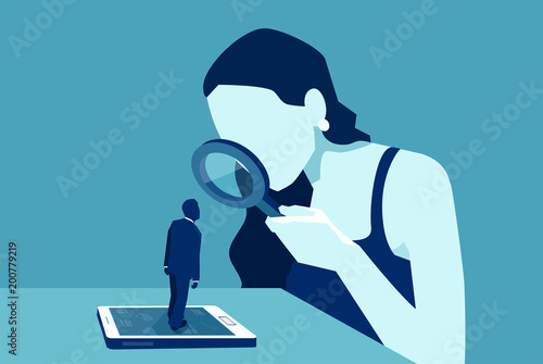 Vector of a woman with magnifying glass looking at a man standing on smartphone or tablet
