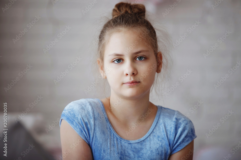 A young ballerina in blue clothes on a white background. A young ballerina in blue clothes on a white background.
