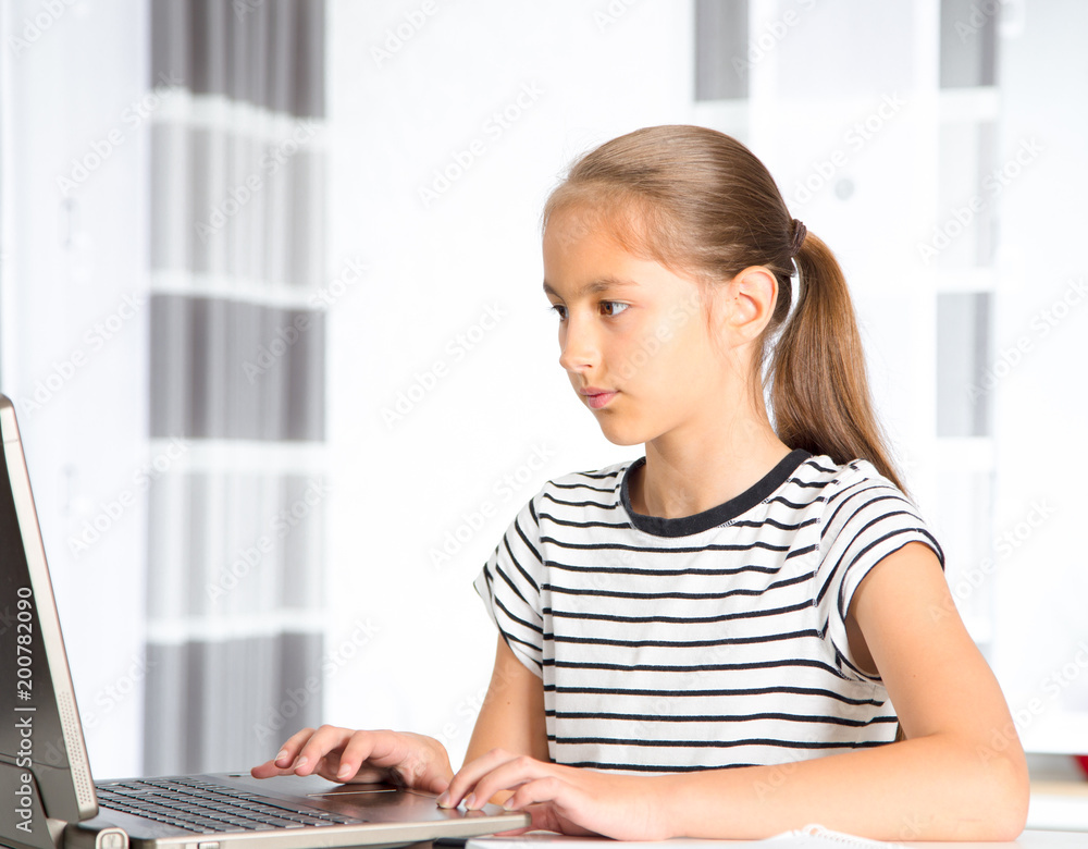 Teenage girl preparing for exams. Teenage girl doing homework. Teenage girl preparing for exams. Teenage girl doing homework.
