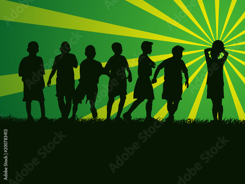 silhouette group of kids playing soccer on grass field