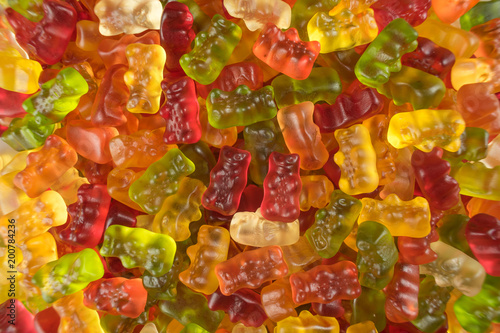 Heap of colorful jelly babies / gummy bear candy sweets. Potential use as a background.