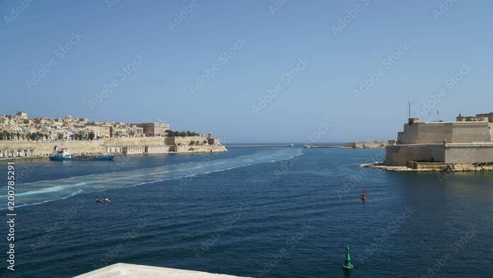 Timelapse View of the Mediterranean Sea,Valletta and the island of Malta from the Fort Saint Angelo.. Timelapse of boat sail. Timelapse View of the Mediterranean Sea,Valletta and the island of Malta from the Fort Saint Angelo.. Timelapse of boat sail.