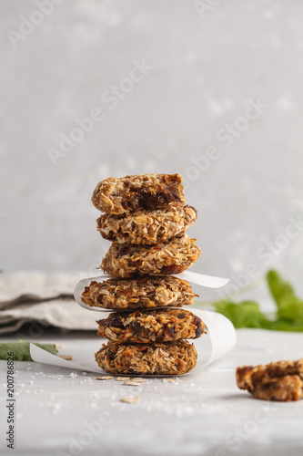 Vegan oatmeal cookies with dates and a banana. Healthy vegan detox dessert on a light background, copy space