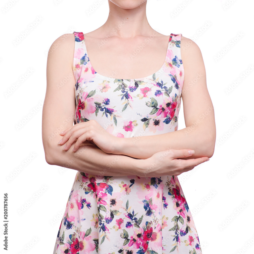 Woman in a dress floral print folded her arms Woman in a dress floral print folded her arms
