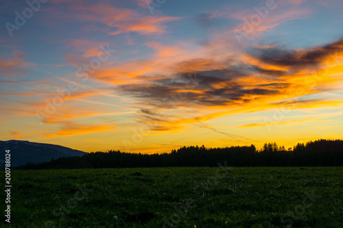 Germany, Awesome cloudscape, dramatic orange sky over black forest nature landscape © Simon