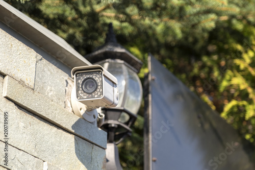 Street surveillance camera on the fence.