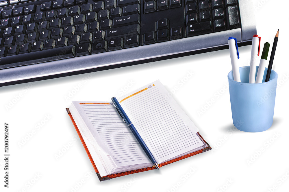 Work place with computer keyboard, diary, pen, pencil cup on. Isolated. Work place with computer keyboard, diary, pen, pencil cup on. Isolated.